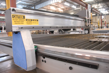 Close up photo shows the gantry of the plasma cutting table